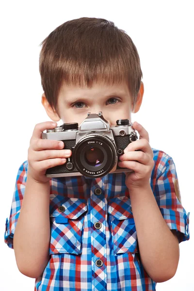 Pequeño niño fotógrafo disparo con cámara SLR aislado —  Fotos de Stock