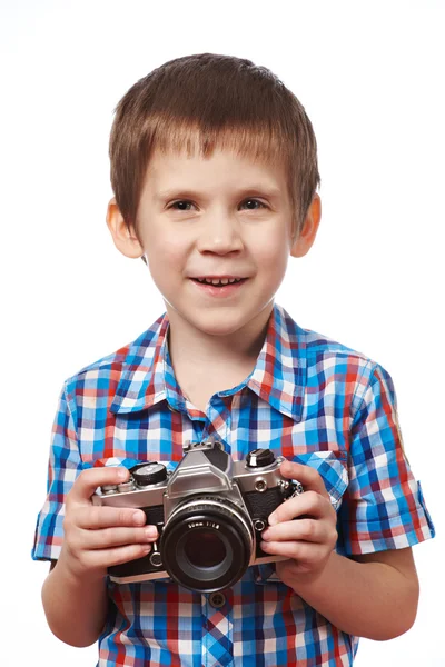 Mały chłopiec fotograf fotografowania z lustrzanka na białym tle — Zdjęcie stockowe