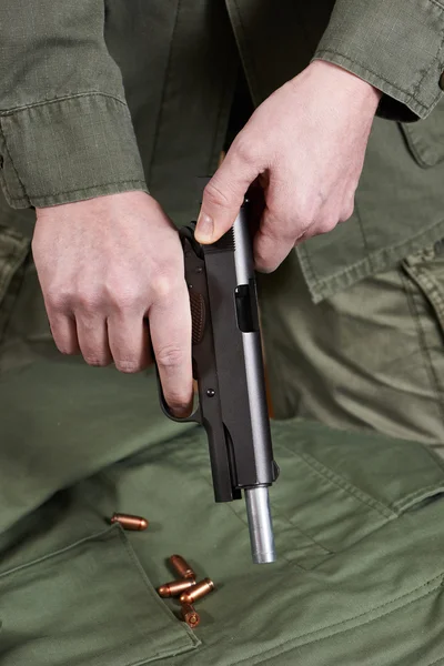 Soldier shutter cocking pistol gun Colt — Stock Photo, Image