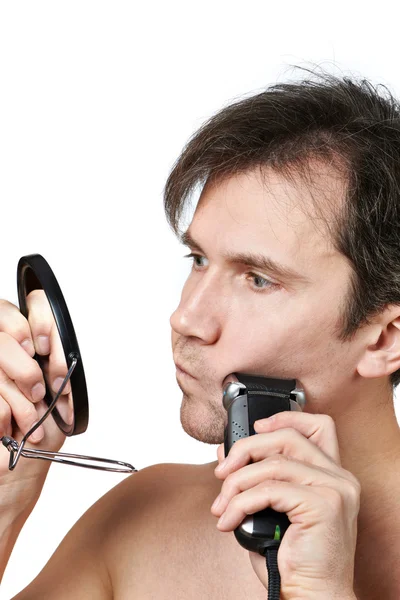 Man shaving face with electric razor — Stock Photo, Image