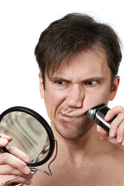 Man shaving face with electric razor — Stock Photo, Image