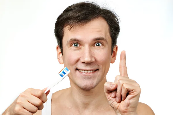 Homem escovando os dentes — Fotografia de Stock