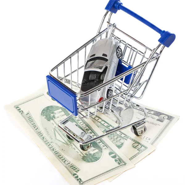 Shopping trolley with money and toy car — Stock Photo, Image