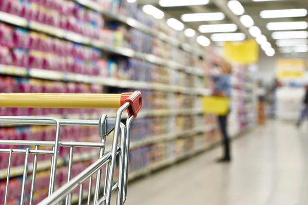 Cart buyer in supermarket — Stock Photo, Image