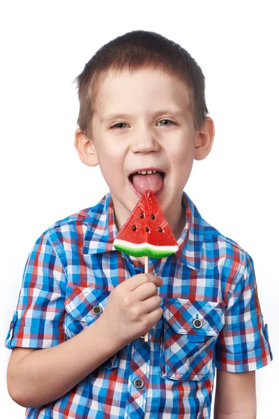 Little boy eating a lollipop watermelon — Stock Photo, Image