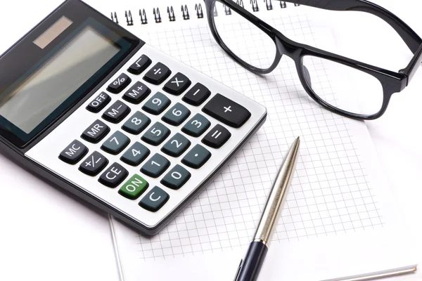 Calculator, pen and glasses isolated — Stock Photo, Image