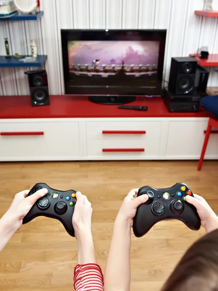 Children playing on games console