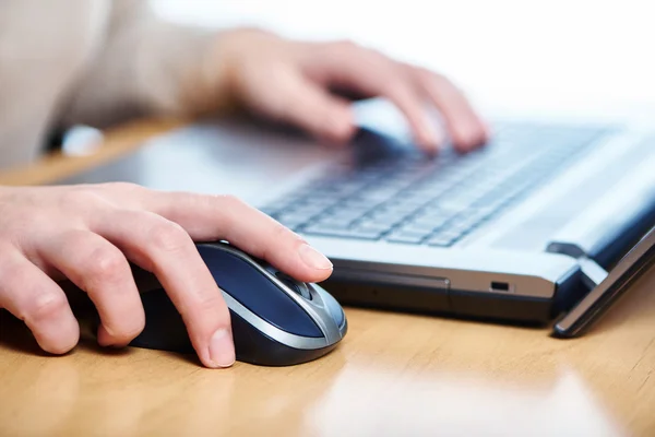 Female hand touching computer mouse — Stock Photo, Image