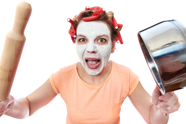 Funny housewife with roller-pin and pan — Stock Photo, Image