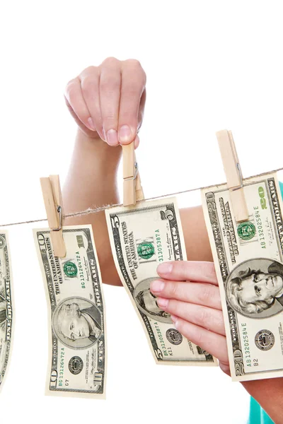 Hand pinch money on clothes line isolated — Stock Photo, Image