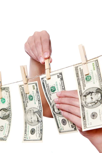 Hand pinch money on clothes line isolated — Stock Photo, Image