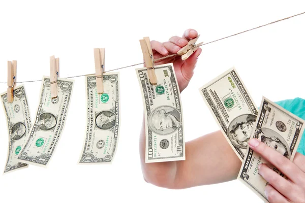 Hand pinch money on clothes line isolated — Stock Photo, Image