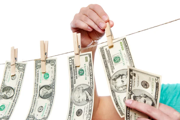 Hand pinch money on clothes line isolated — Stock Photo, Image