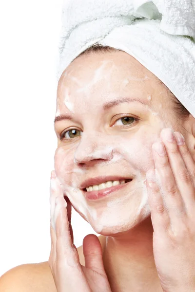 Woman clears a face skin foam — Stock Photo, Image