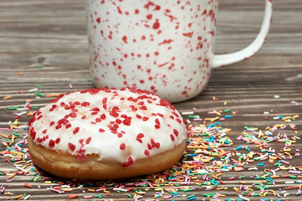 Donut e xícara de chá — Fotografia de Stock