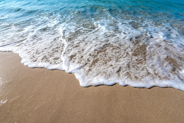 Våg på stranden — Stockfoto