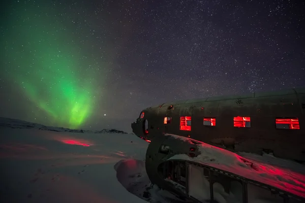 northern lights over plane wreck