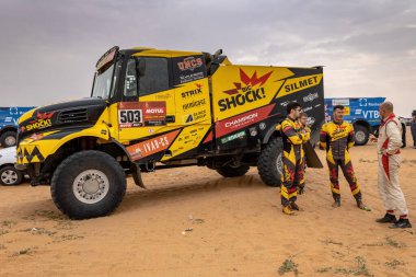 Riyadh, Saudi Arabia - January 7, 2021: The crew of Team Big Shock Racing near their truck Iveco before the start of Stage 5 of Dakar Rally