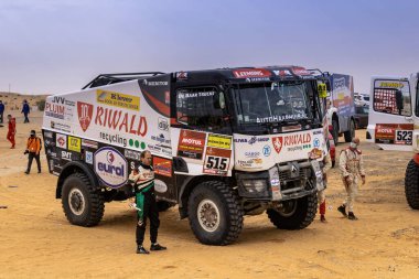 Horimlaa, Saudi Arabia - January 7, 2021: The crew member of Riwald Dakar Team near its Renault racing truck before the start of Stage 5 of Dakar Rally