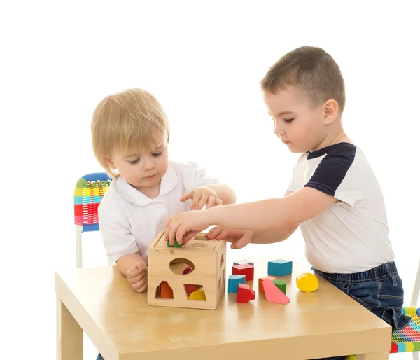 Brothers playing in the puzzle — Stock Photo, Image