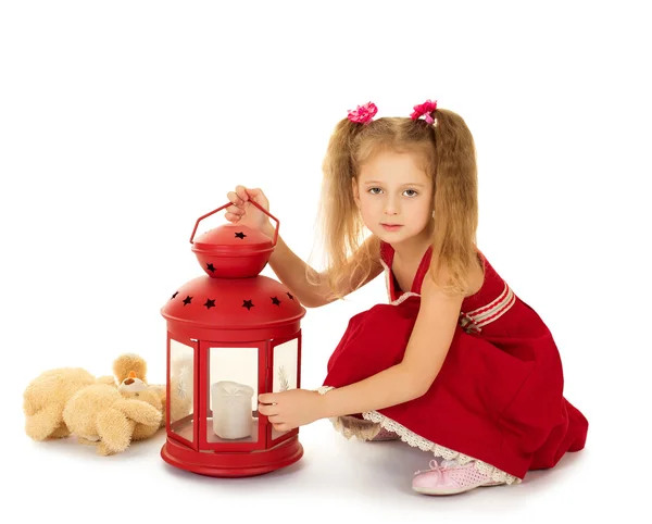 Girl kindle the lamp — Stock Photo, Image