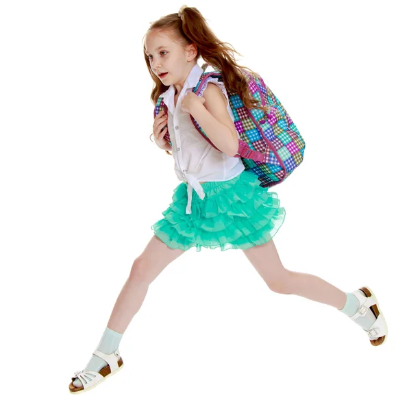 Schoolgirl jumping with a briefcase — Stock Photo, Image