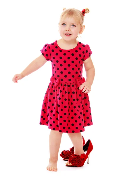 Little girl trying on her mothers shoes — Stock Photo, Image