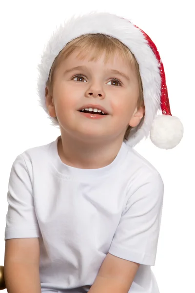 The boy in the hat of Santa Claus Royalty Free Stock Images