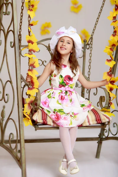 Girl swinging on a swing — Stock Photo, Image