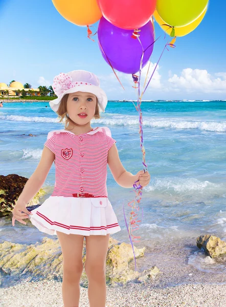 Girl holding balloons — Stock Photo, Image