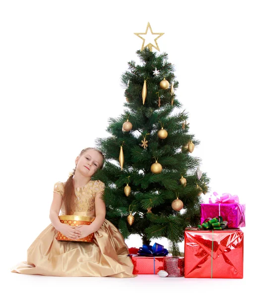 Elegant girl near the Christmas tree — Stock Photo, Image