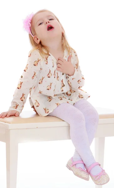 Girl sitting on a stool — Stock Photo, Image