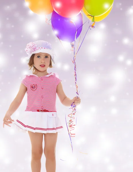 Girl holding balloons — Stock Photo, Image