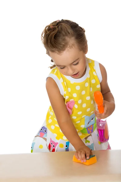 Little girl cleans the table — Stock Photo, Image