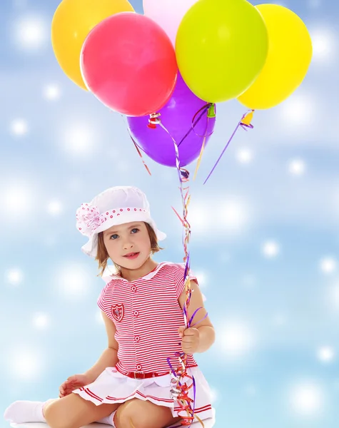 Girl holding balloons — Stock Photo, Image