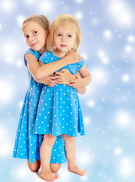 Sisters in blue dresses — Stock Photo, Image