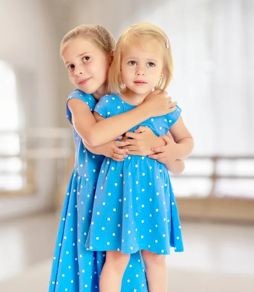 Sisters in blue dresses — Stock Photo, Image