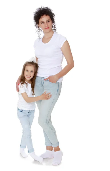 Mom and daughter in jeans  white shirts — Stock Photo, Image