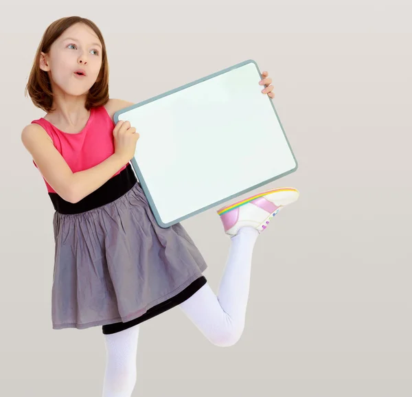 Little girl holding white poster. — Stock Photo, Image