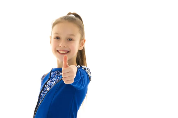 Little girl holds her thumb up. Baby emotion concept. — Stock Photo, Image