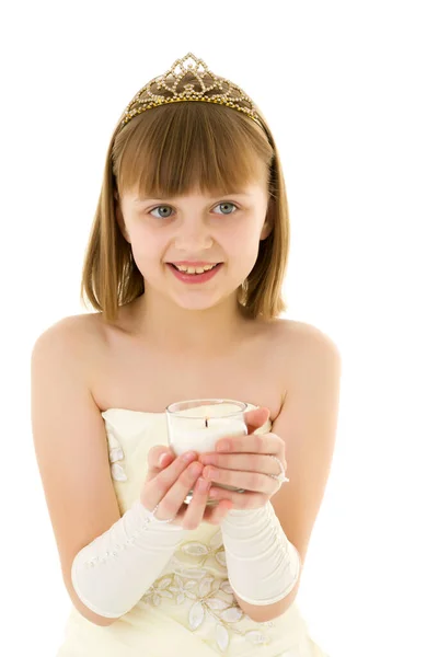 Little girl in a New Year costume with a candle. Stock Picture