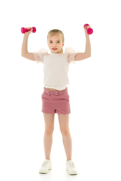 Menina fazendo exercícios com halteres. — Fotografia de Stock