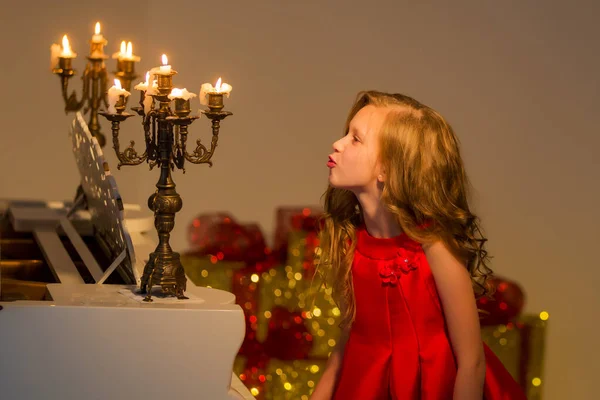 Charming Preteen Girl Blowing out Candles in Vintage Chandelier — Stock Photo, Image