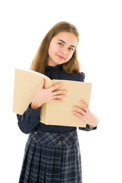 Cute little girl with a book in her hands, the concept of literature, school, study. — Stock Photo, Image