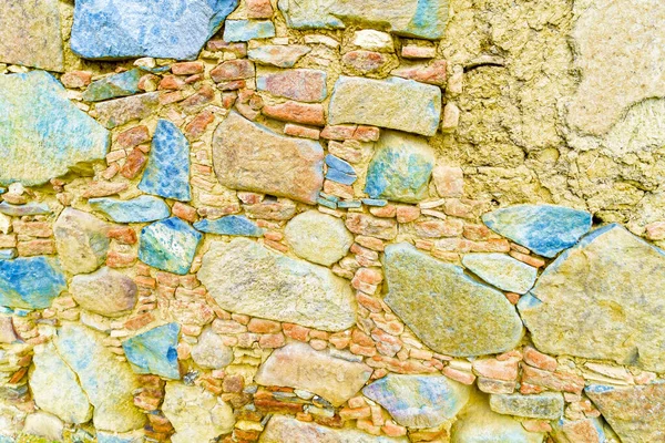 Parede de pedra antiga feita de pedras duras naturais, alvenaria antiga — Fotografia de Stock