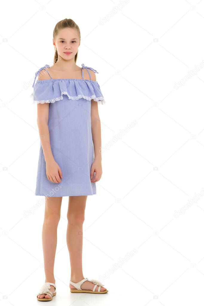Pretty Girl in Fashionable Dress Standing and Smiling at Camera