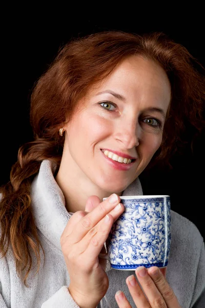 Woman holding mug in her hands Royalty Free Stock Photos