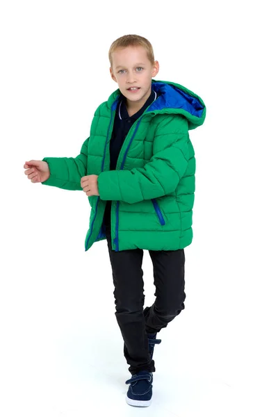 Smiling boy in unbuttoned green winter jacket — Stock Photo, Image