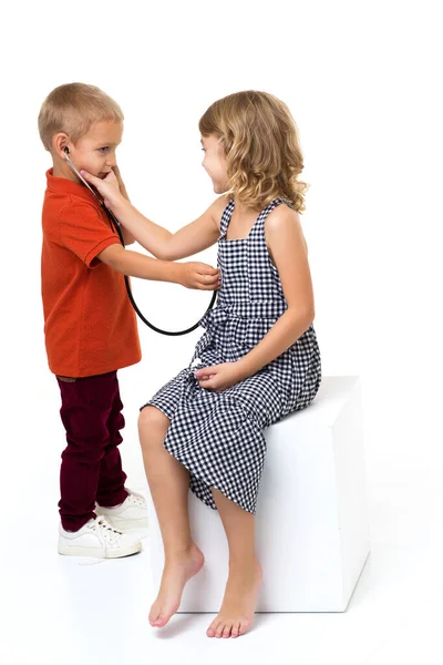 Cute children playing doctor and patient Stock Picture