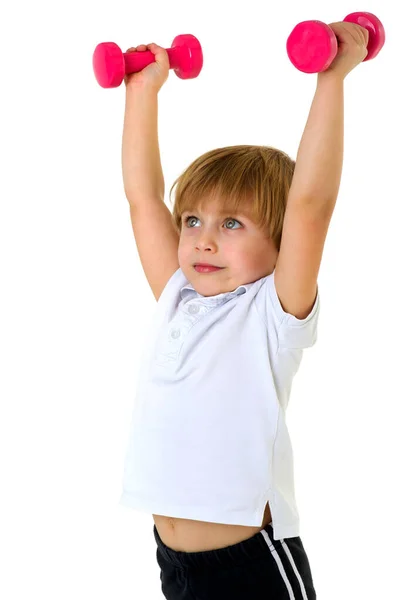Cute little boy exercising with dumbbells — Stock Photo, Image